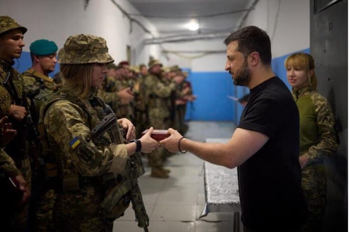 Ukraine says it retakes more ground as Zelenskiy visits front lines