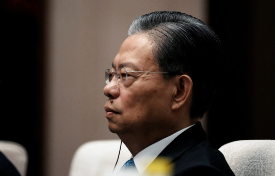 China willing to enhance North Korean ties, top legislator says on visit