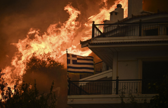 Greek wildfire rages near Athens; towns, hospitals evacuated