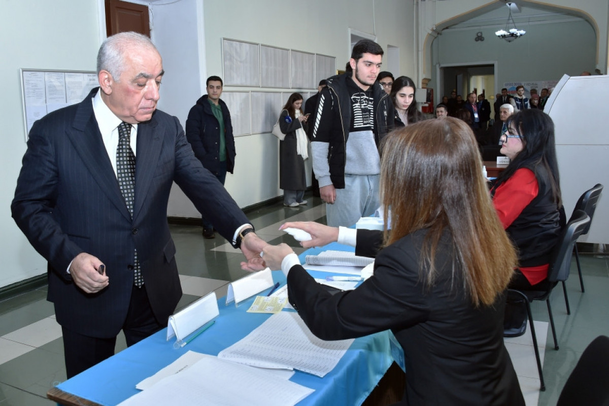 Prime Minister Ali Asadov casts his vote at polling station No. 2