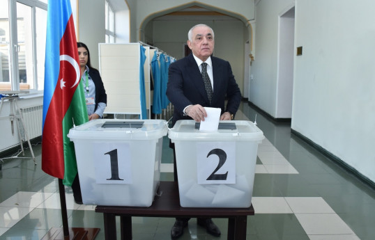 Prime Minister Ali Asadov casts his vote at polling station No. 2
