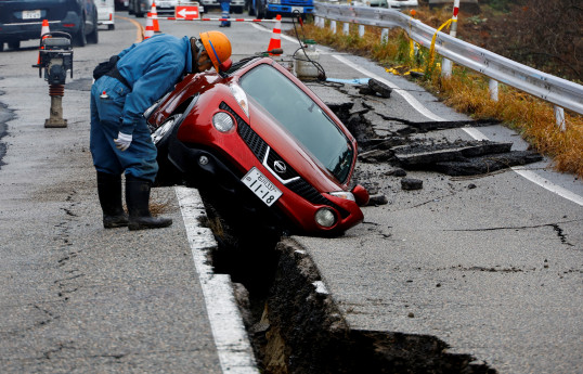 Japan quake: survivors face freezing rain, threat of landslides