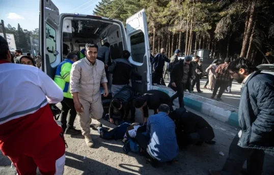 Iran vows harsh response after 95 killed near general's tomb