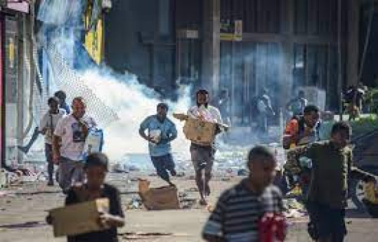 Fifteen dead in Papua New Guinea after day of looting, arson