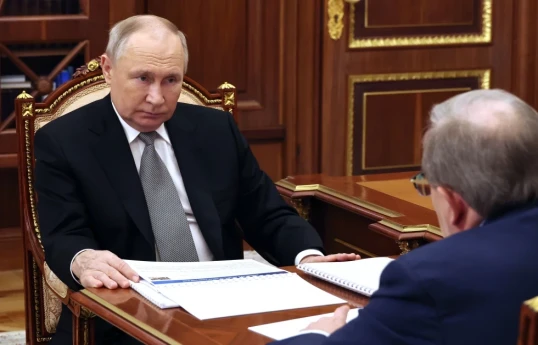 Russian President Vladimir Putin, left, meets with Russian Academy of Sciences President Gennady Krasnikov at the Kremlin in Moscow, Russia, Tuesday, Jan. 30, 2024. (Gavriil Grigorov, Sputnik, Kremlin Pool Photo via AP)