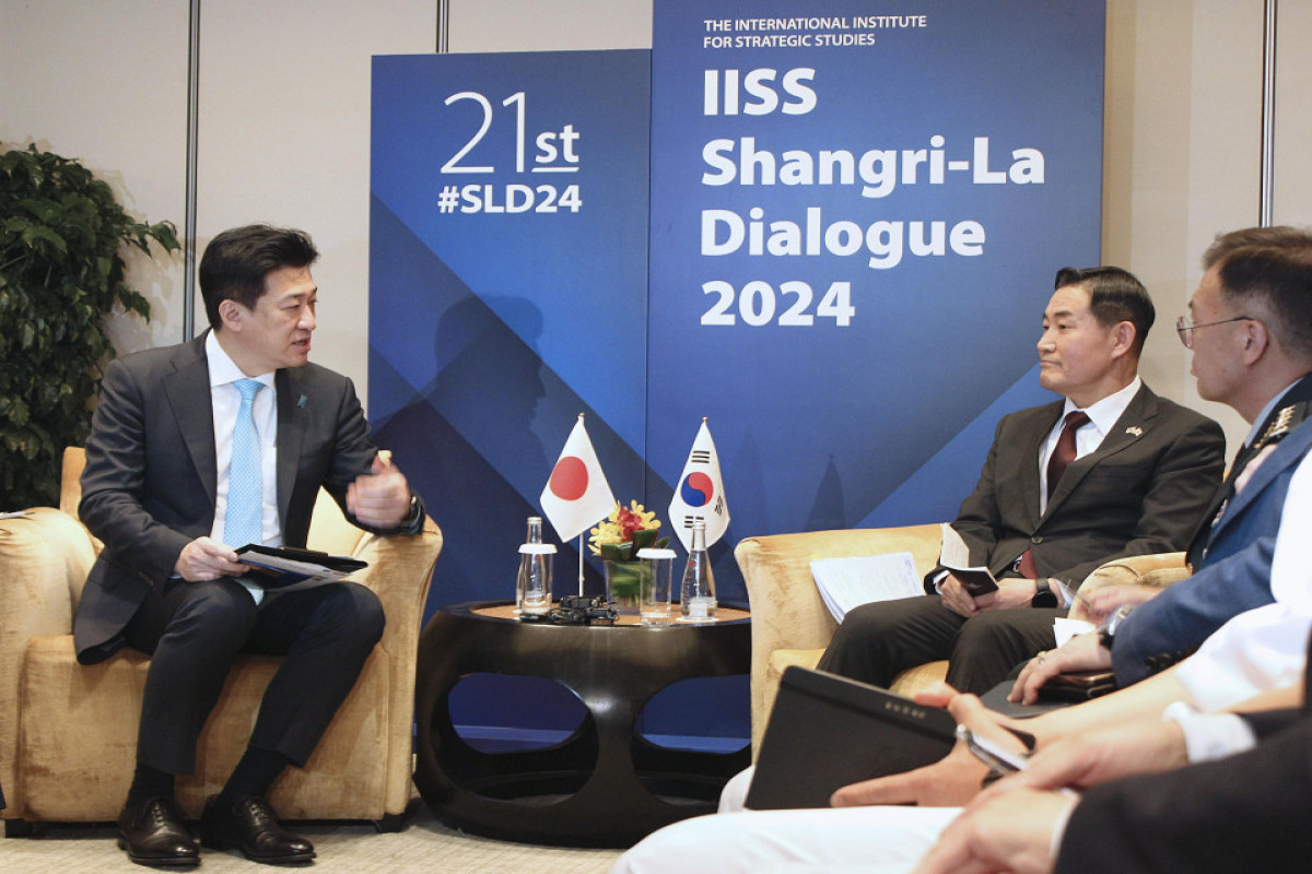 Japanese Defense Minister Minoru Kihara (L) and his South Korean counterpart Shin Won Sik (2nd from R) hold talks on the sidelines of the three-day Asia Security Summit in Singapore on June 1, 2024.