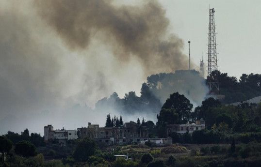 Hezbollah fires dozens of rockets at northern Israel