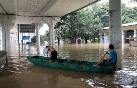 Rains lash southern China as rising rivers threaten more flooding