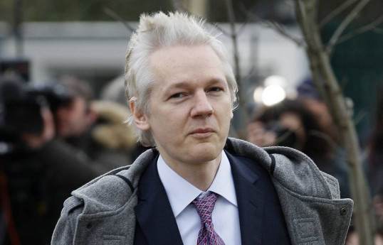 Assange released from British prison, left UK by plane