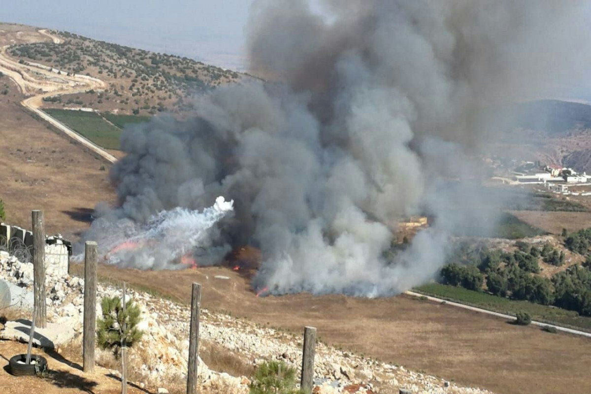 Hezbollah fires 30 missiles at Israeli barracks in Golan Heights