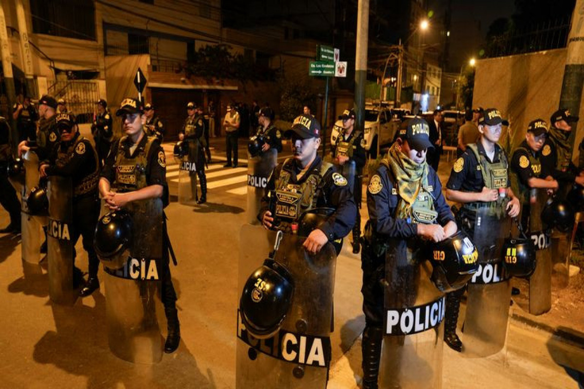 Peru police raid president