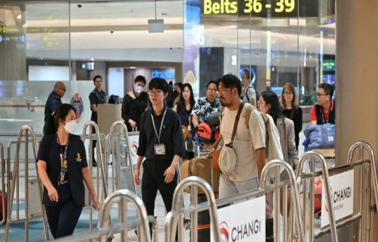 Shaken passengers arrive in Singapore after deadly turbulence-stricken flight