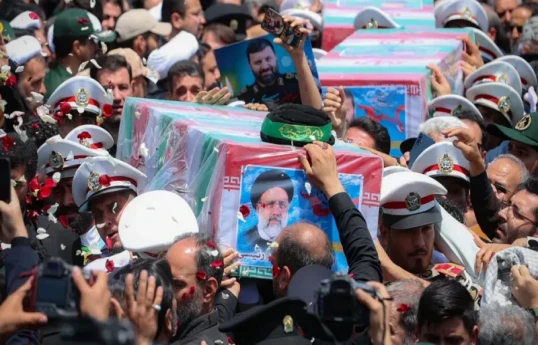 Iran burying late president at shrine in home city of Mashhad