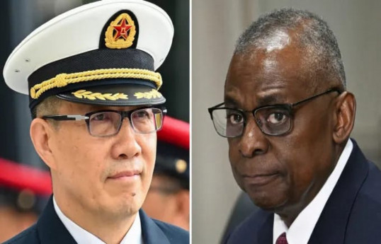China’s Minister of National Defense Adm. Dong Jun and US Defense Secretary Lloyd Austin