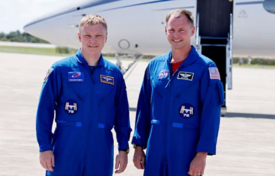 NASA's Crew-9 astronaut Nick Hague (R) and Roscosmos cosmonaut Alexander Gorbunov arrive at the Kennedy Space Center ahead of their launch to the International Space Station in Cape Canaveral, Florida, U.S., September 21, 2024.