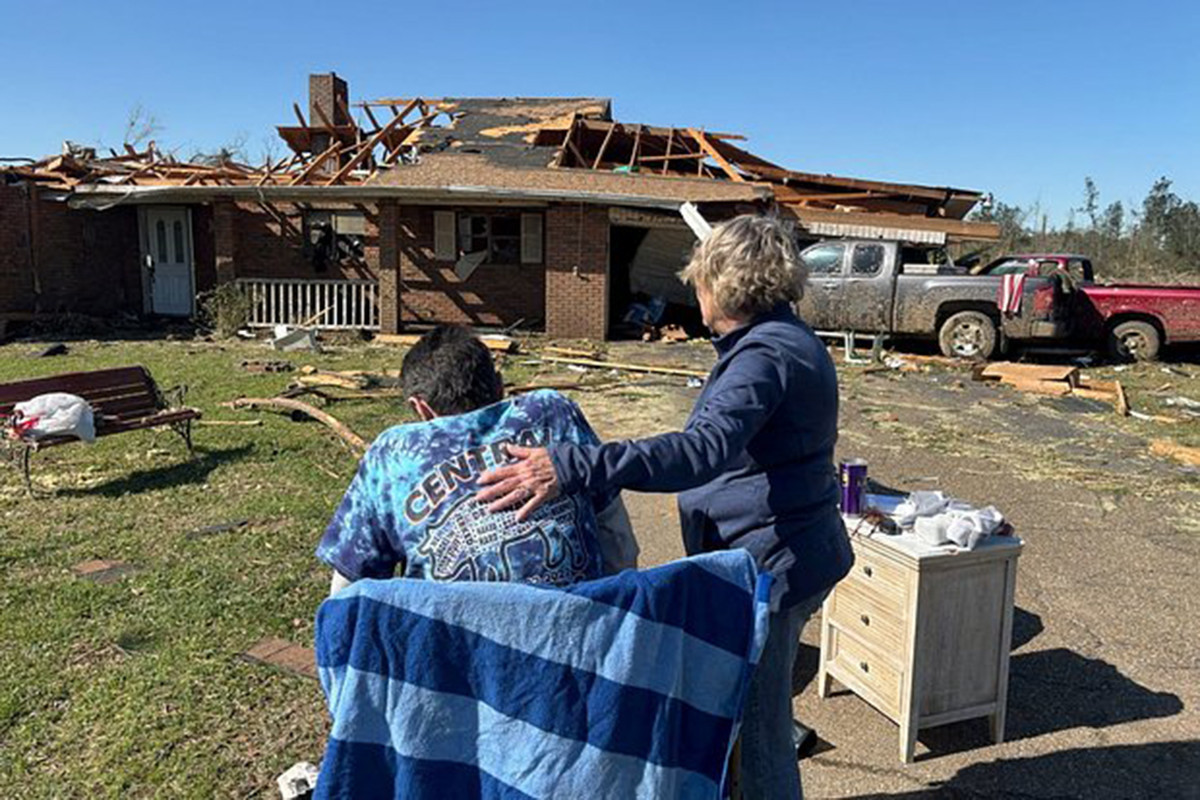At least 16 dead in flooding and tornadoes as storms slash US South and Midwest