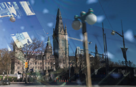 Canadians vote in election dominated by concerns about Trump