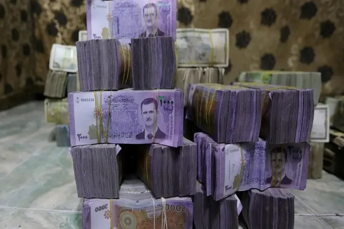 Exclusive: Syria to revalue currency, dropping two zeros in bid for stability, sources say