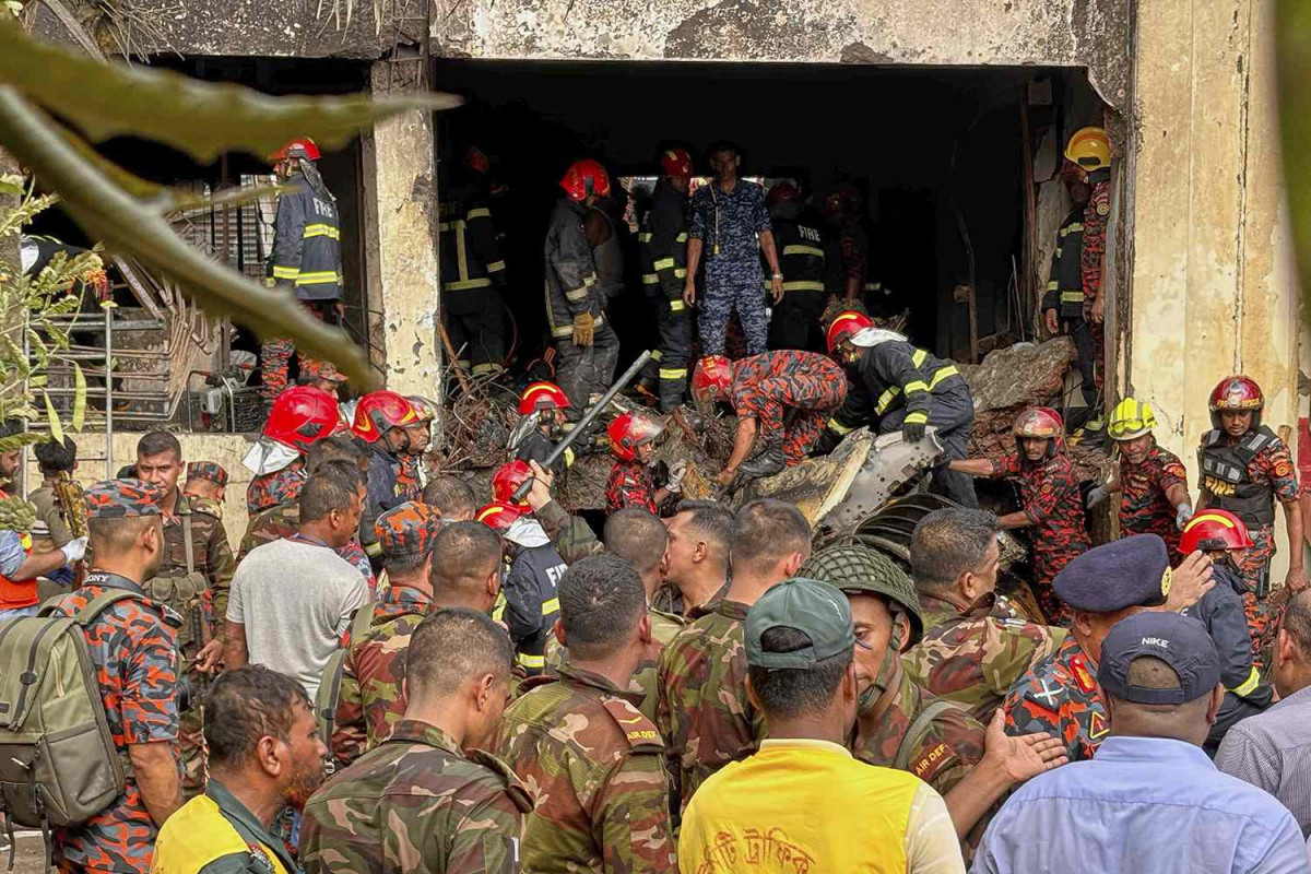 At least 19 killed as Bangladesh air force plane crashes into college campus