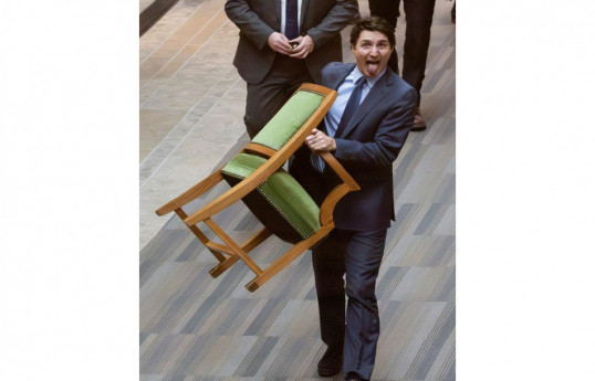 Justin Trudeau takes his chair while leaving Canada’s House of Commons -PHOTO 