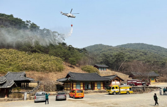 South Korean officials say a helicopter engaged in firefighting crashed