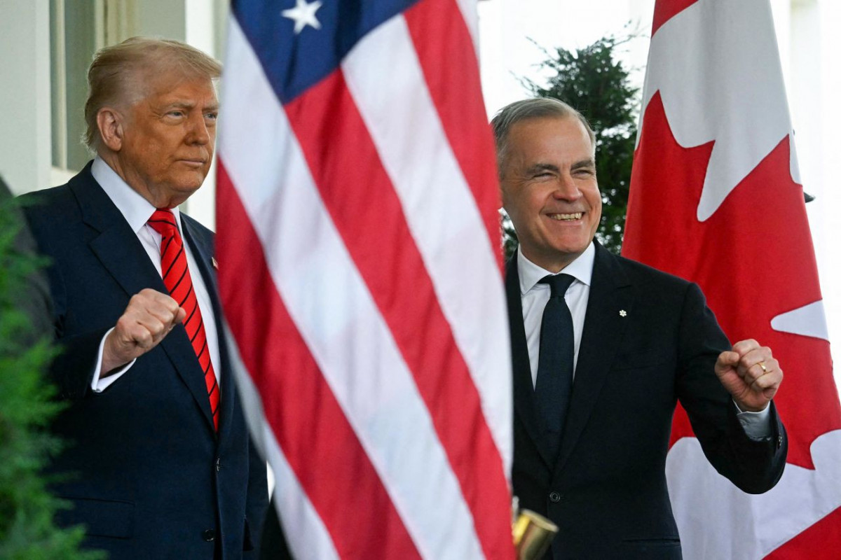 President Donald Trump greets Canadian Prime Minister Mark Carney as he arrives at the White House in Washington