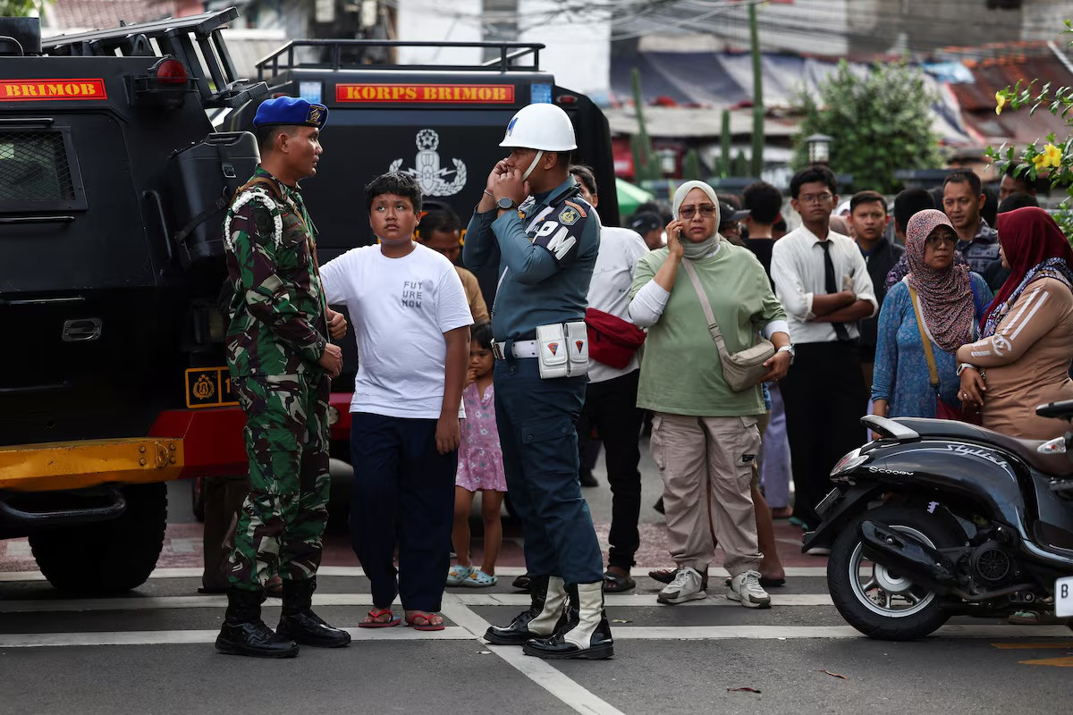 Blasts injure dozens at Indonesian mosque, student suspected