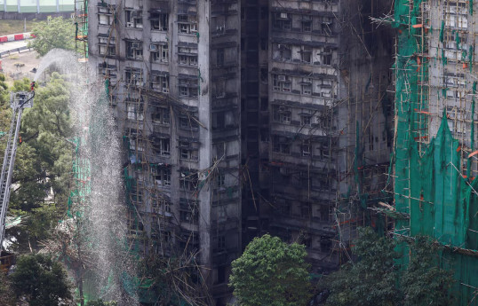Hong Kong tower fire toll rises to 128, more arrests made