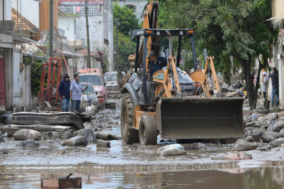 Death toll from torrential rains in Mexico rises to 64 as search operations expand
