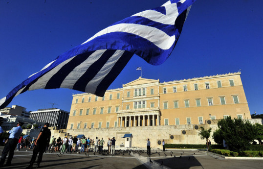 Greece adopts law extending working hours despite protests