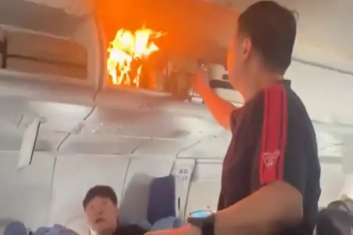 Air China flight lands safely after fire in cabin caused by battery