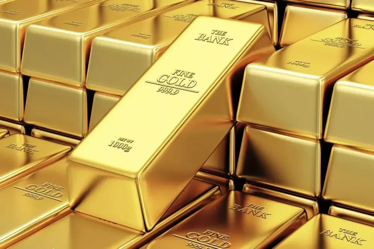 Gold inches down as dollar firms, focus on US inflation data
