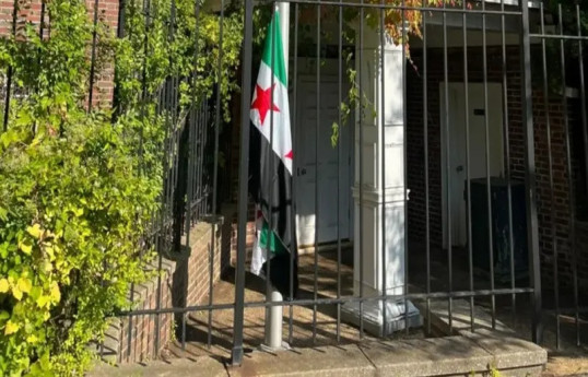 Syrian FM raises flag over embassy in Washington, first time in decade