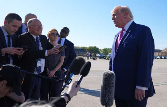 Trump says focus of Iran deal is nukes and that Strait of Hormuz will reopen "automatically"