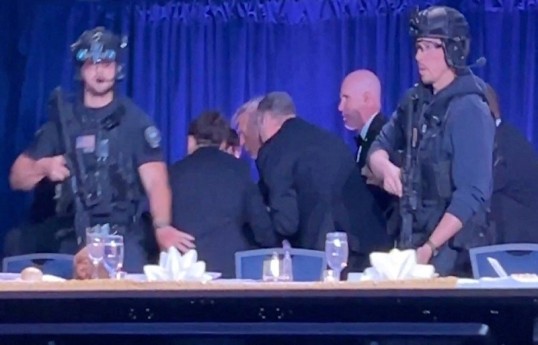 US leader rushed to safety after shots fired