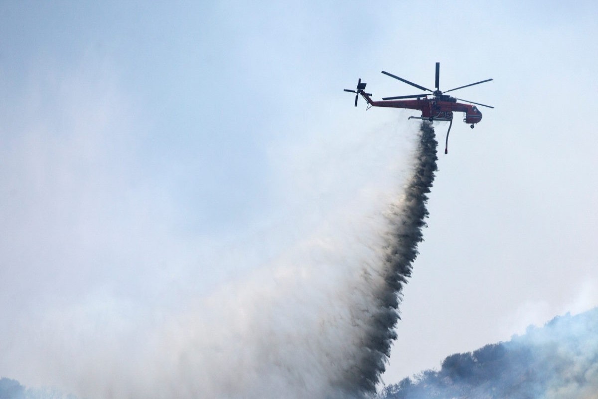 Helicopter battling Utah wildfire crashes with no word on the 2 people aboard