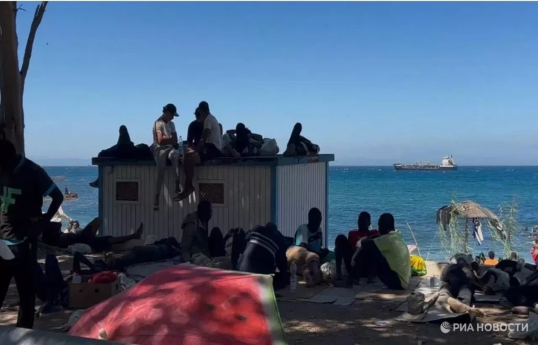 In Spain's Ceuta, hundreds of migrants stage protest and demand asylum