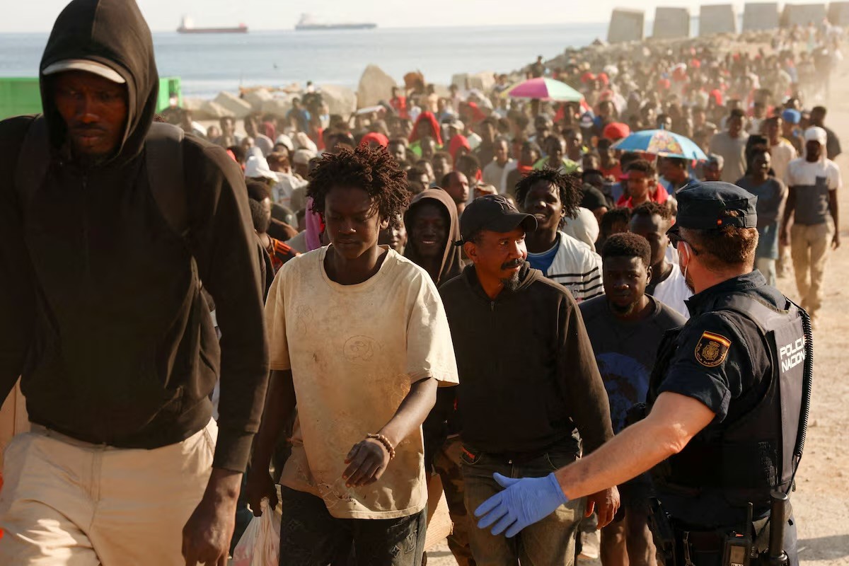 Spain asks EU for help processing migrants in Ceuta