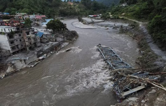 Nepal and China resume flood rescue after lake threat eases, death toll nears 600