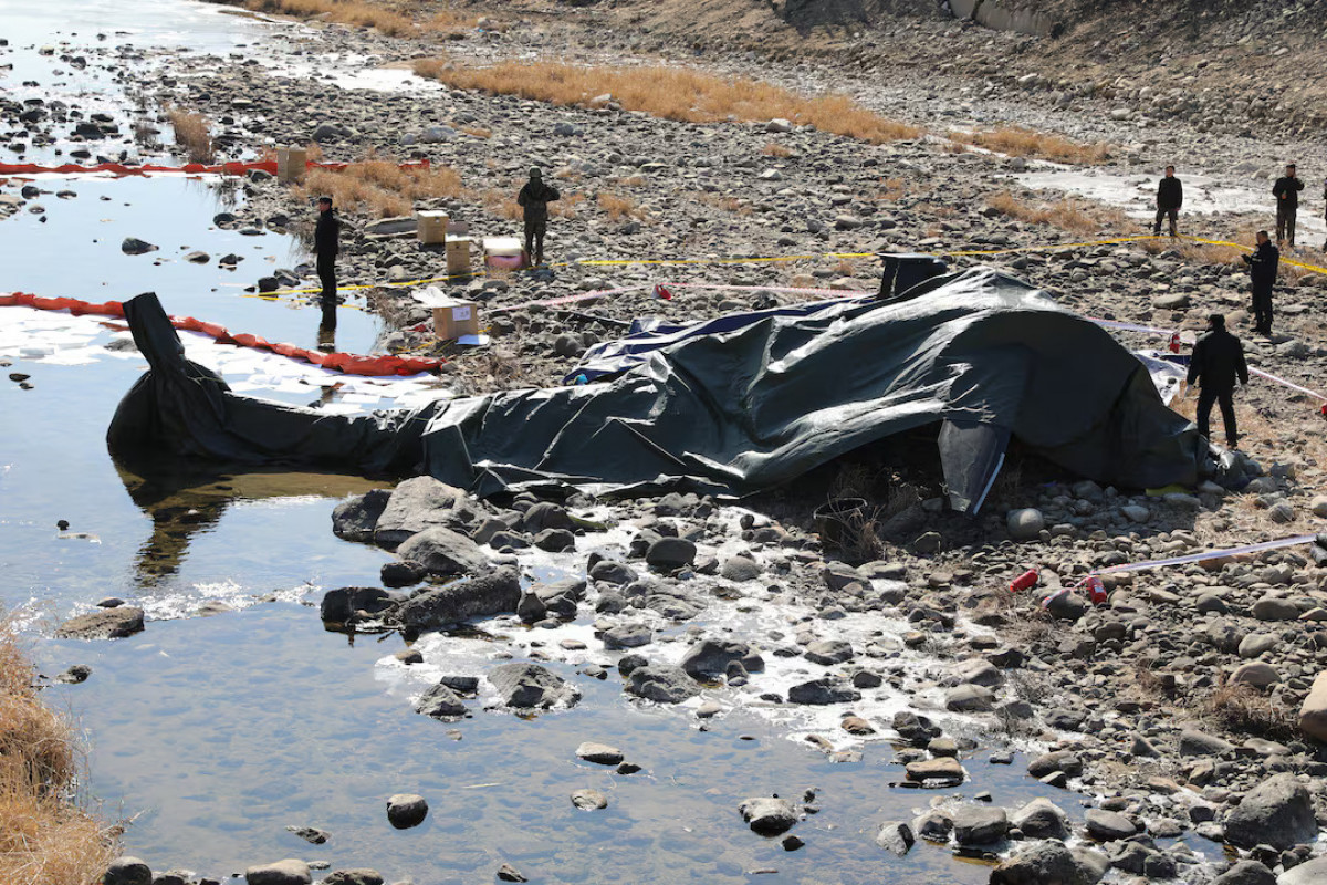 South Korean military officials secure the site where an AH-1S Cobra attack helicopter crashed in Gapyeong, South Korea, February 9, 2026.
