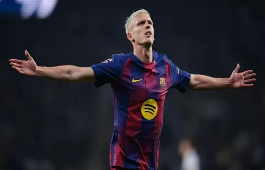 Barcelona moved seven points clear at the top of La Liga after Dani Olmo and Robert Lewandowski struck late against Espanyol