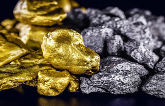 Gold slides from 1-week high on profit-booking, dollar strength