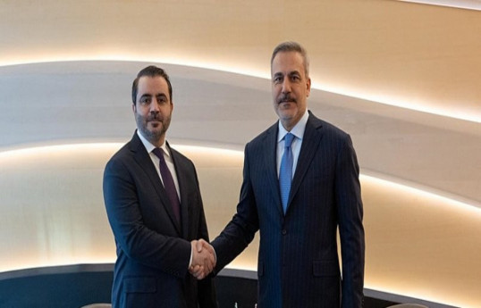 Syrian FM Asaad Hassan al-Shaibani and Turkish Foreign Minister Hakan Fidan