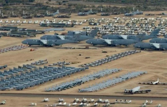 US lowers security alert at Qatar air base, sources say