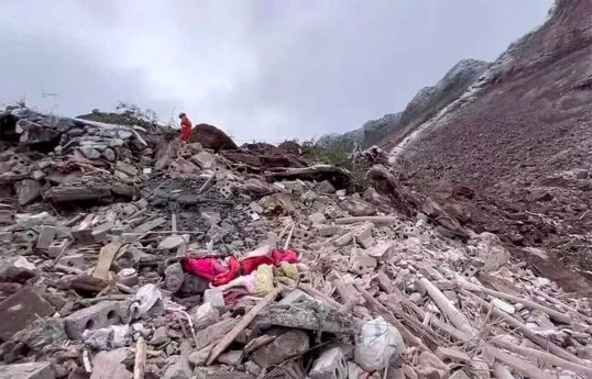 Two dead and six missing after landslides hit house and campground in New Zealand