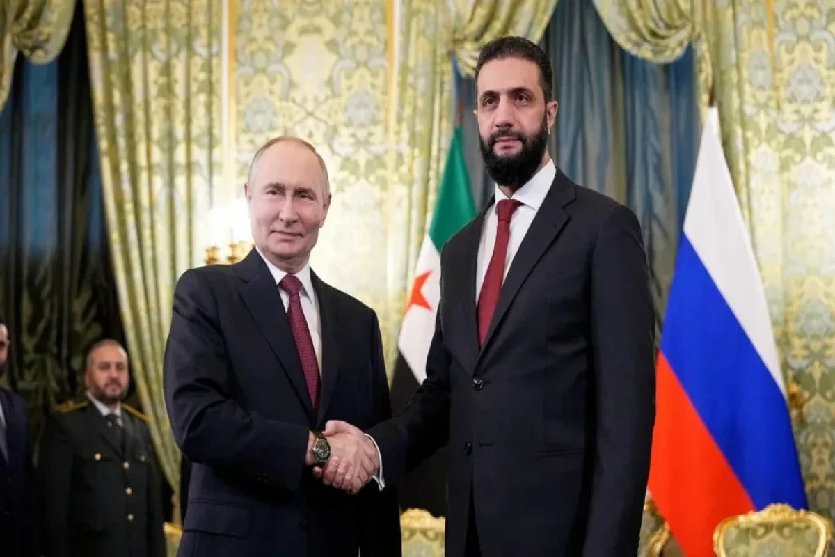 Russian President Vladimir Putin, Syrian President Ahmed al-Sharaa