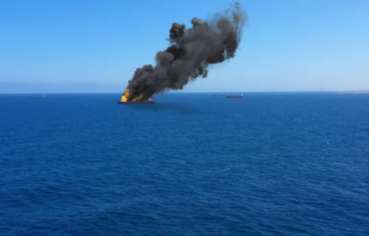Iranian cargo barge struck by US in Gulf of Oman, crew rescued, Iranian official says