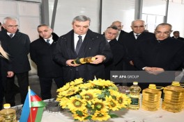 Coordination Headquarters members view sunflower oil plant in Girmizi Bazar settlement