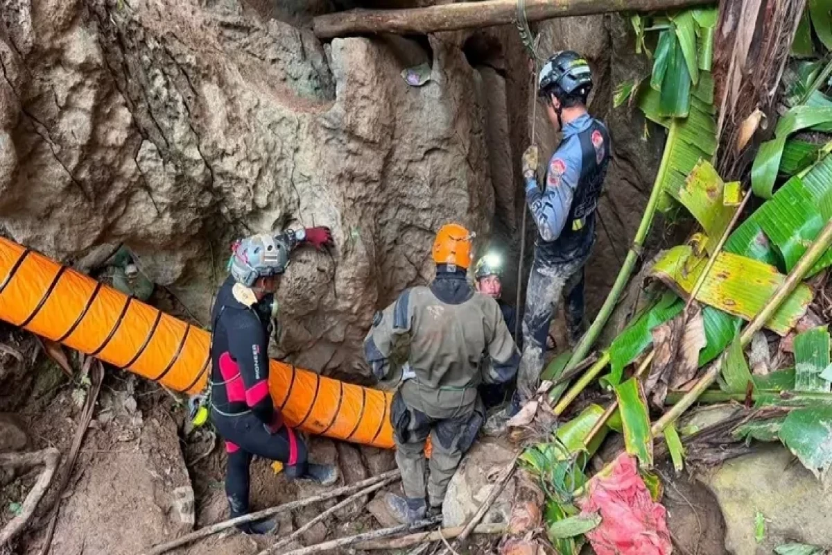 Five of seven people trapped in Laos cave found alive
