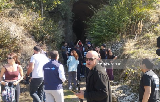 International travelers visit Azykh Cave